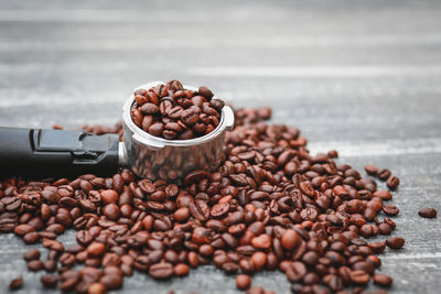 Close-up of roasted coffee beans on table