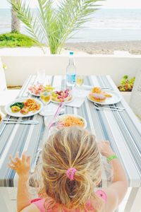 High angle view of woman sitting on table