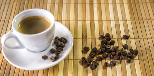 High angle view of coffee cups on table