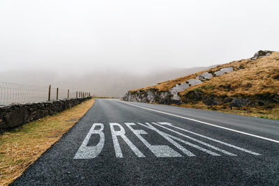 Road leading towards fog