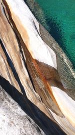 High angle view of rock formation in sea