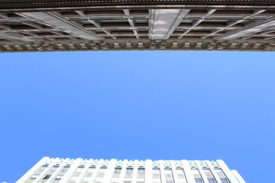 Low angle view of building against clear blue sky