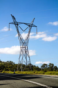 Low angle view of electricity pylon against sky