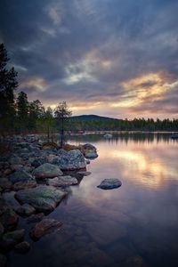 Scenic view of lake against sky during sunset