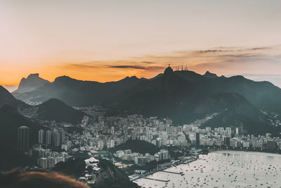 Townscape against sky during sunset