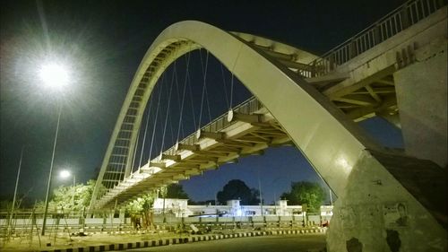 Illuminated bridge at night