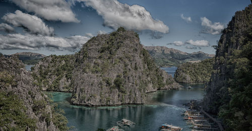 Panoramic shot of river amidst trees against sky