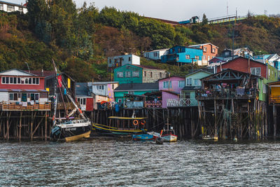 Boats moored at harbor