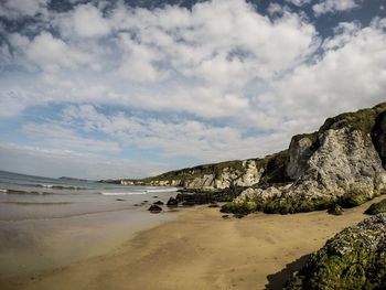 Scenic view of beach against sky