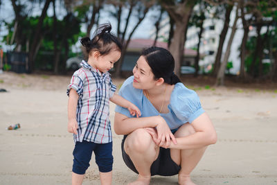 Rear view of couple sitting outdoors