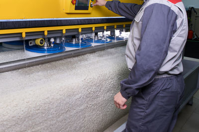 Low section of man working on railroad track