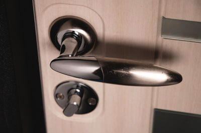 Entrance door handle close up. lock and handle on the door