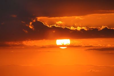 Low angle view of dramatic sky during sunset