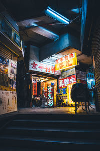 Illuminated street market at night