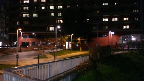 Illuminated buildings in city at night