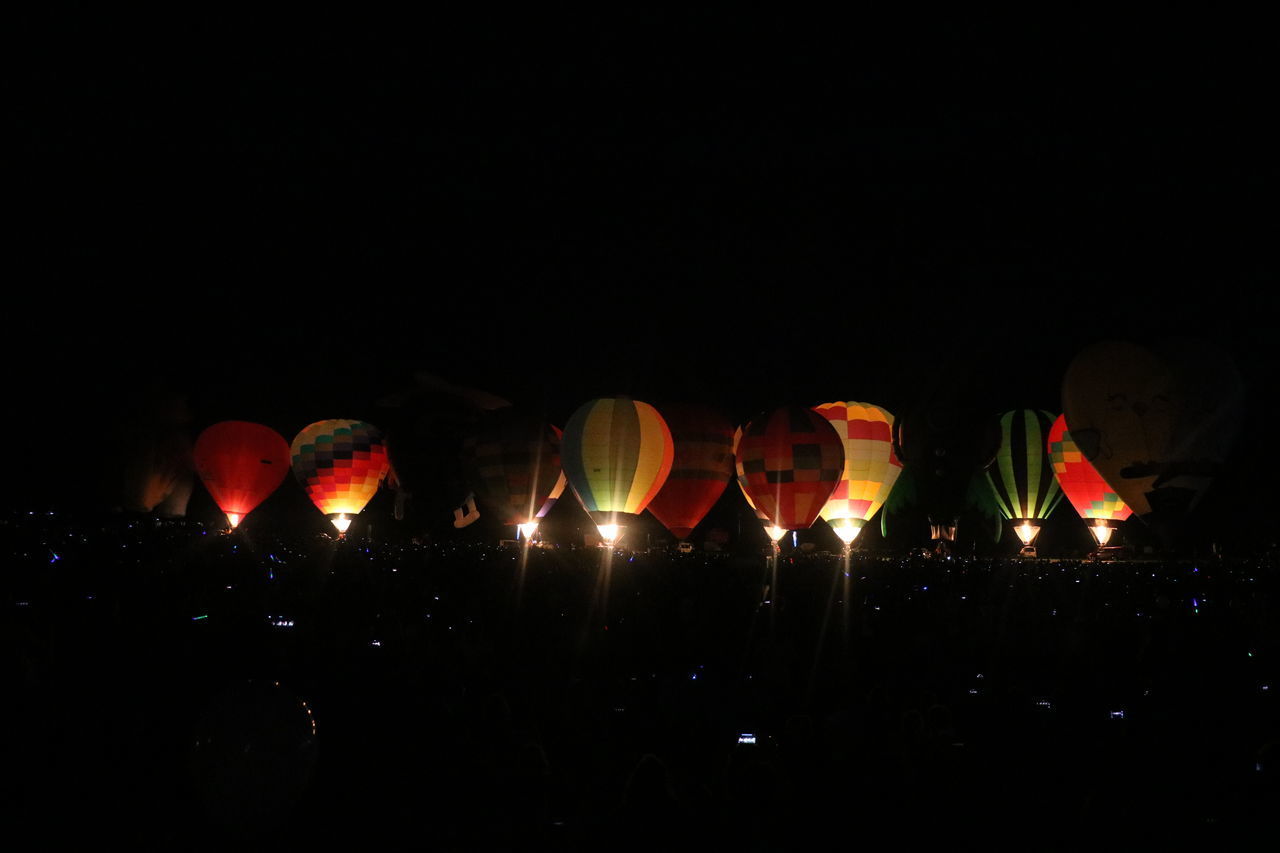 ILLUMINATED HOT AIR BALLOONS IN SKY