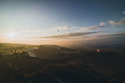 Scenic view of landscape against sky during sunset