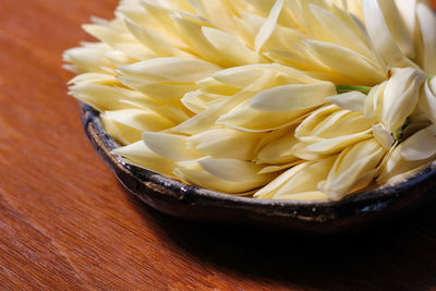 High angle view of yellow in bowl on table