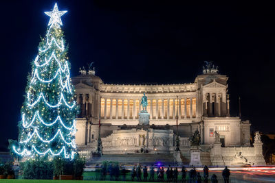 Illuminated christmas tree at night