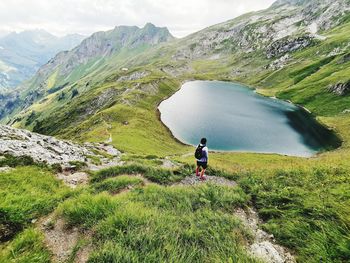 Rear view of woman walking on mountain