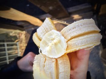 Cropped hand holding ice cream cone
