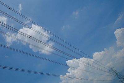 Power cable in cloud-sky background