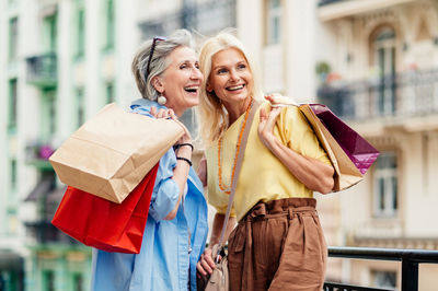 Young woman holding shopping bags