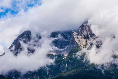 Close-up of snow covered mountain against sky