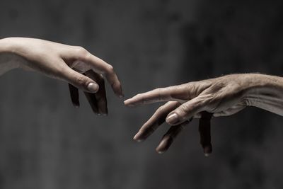 Close-up of people hands against blurred background