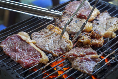 Close-up of meat on barbecue grill