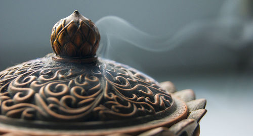 Close-up of old tea cup on table