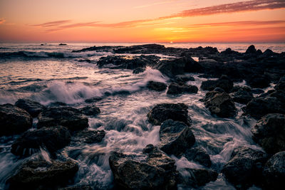 Scenic view of sea against sky during sunset