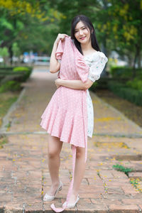 Portrait of smiling woman standing outdoors