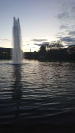 Silhouette of fountain against sky during sunset