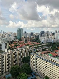 High angle view of buildings in city against sky