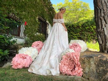 Rear view of woman with pink flowers