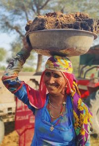 Portrait of a smiling young woman outdoors