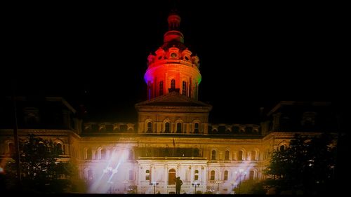 Low angle view of illuminated building at night