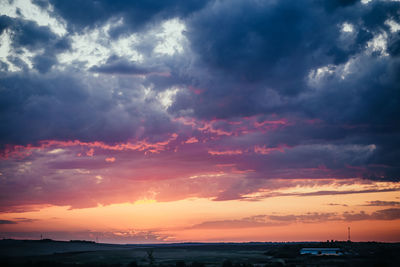 Scenic view of dramatic sky during sunset