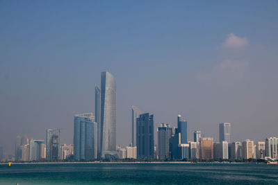 Modern buildings in city against sky