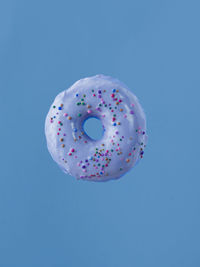 Directly above shot of donut against clear blue sky