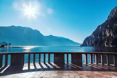 Scenic view of swimming pool against mountains on sunny day