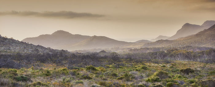 Scenic view of mountains against sky during sunset