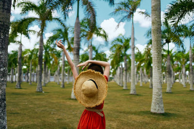 Full length of woman on field against trees