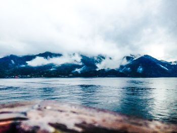 Scenic view of mountains against cloudy sky