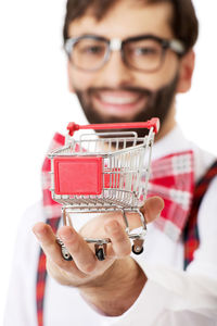 Portrait of smiling man holding camera