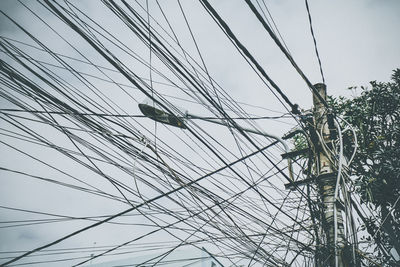 Low angle view of cables against clear sky