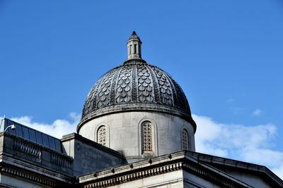 Low angle view of building against blue sky