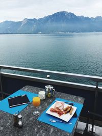 High angle view of breakfast on table against sea