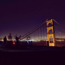 View of suspension bridge at night